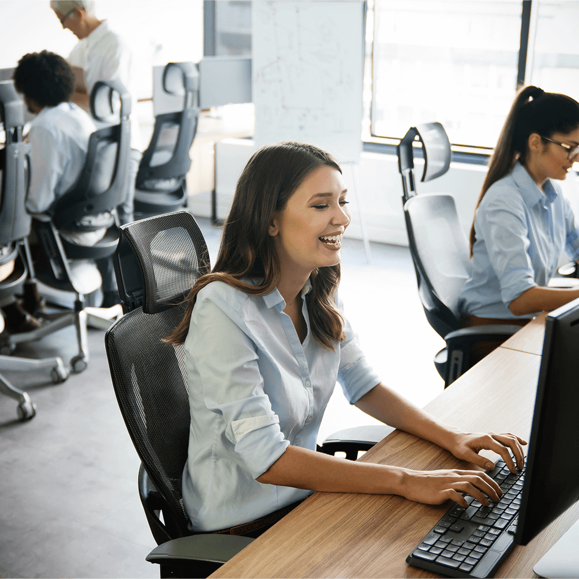 Manage Service – creative-people-working-in-office-on-computer (1)